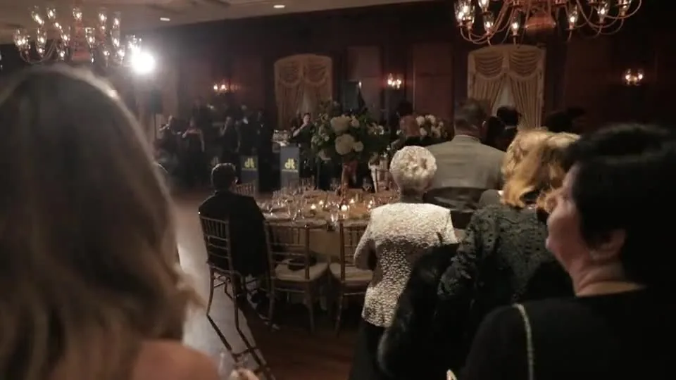 Guests gathered for a candlelit wedding reception