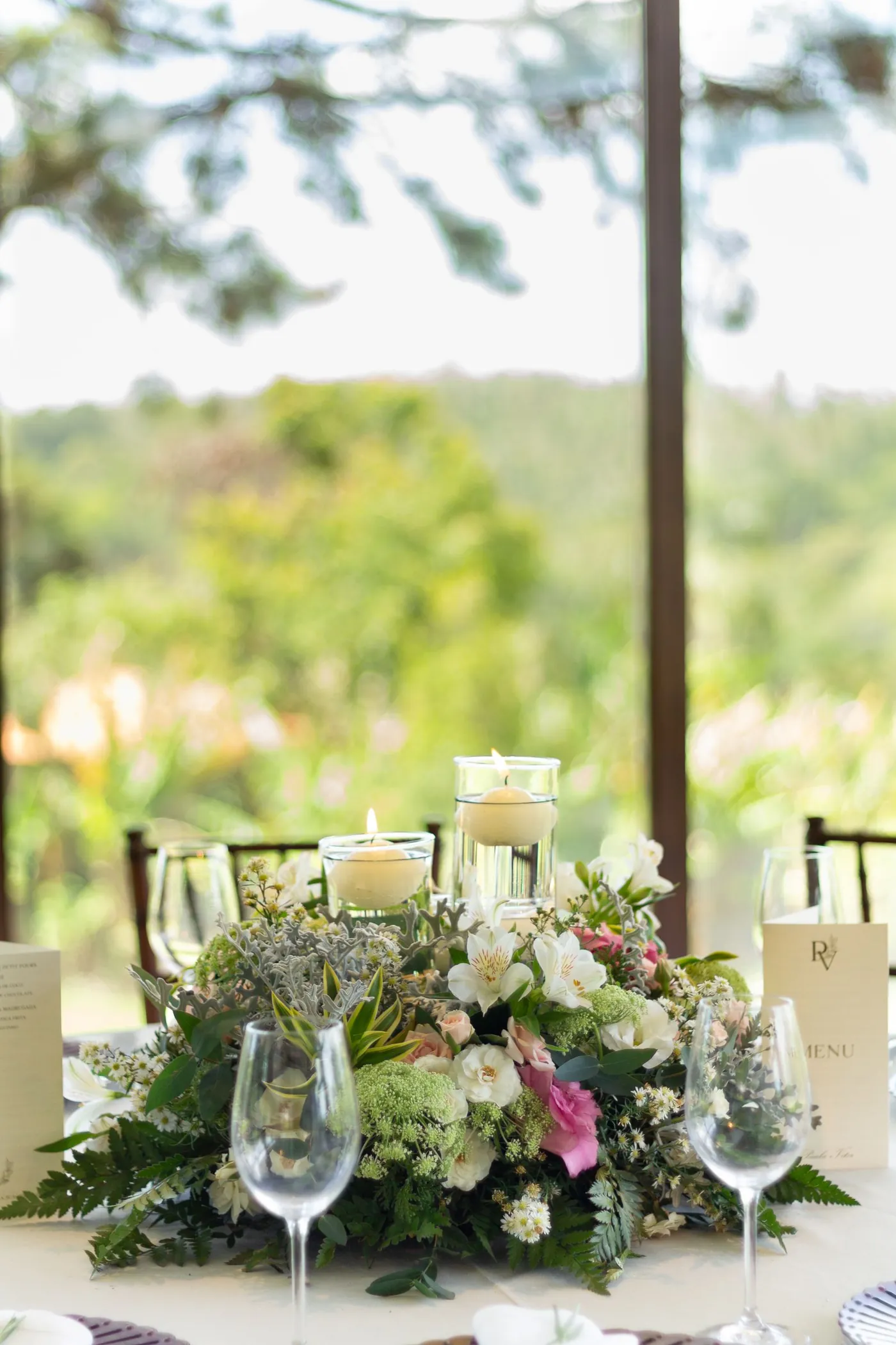 A hand-tied floral centrepiece with candles