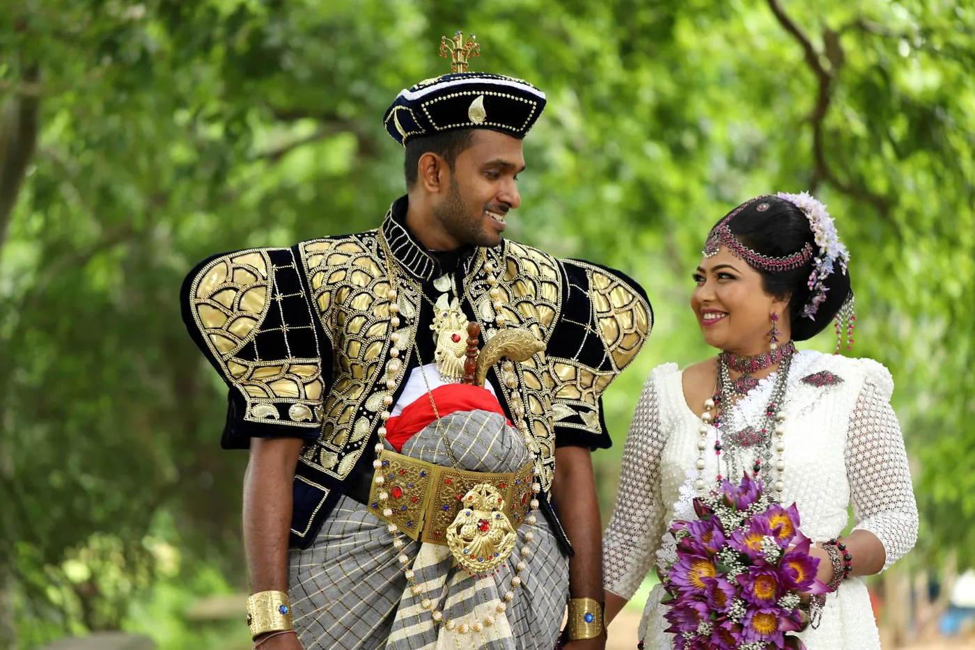 A Sri Lankan couple in ceremonial wedding dress